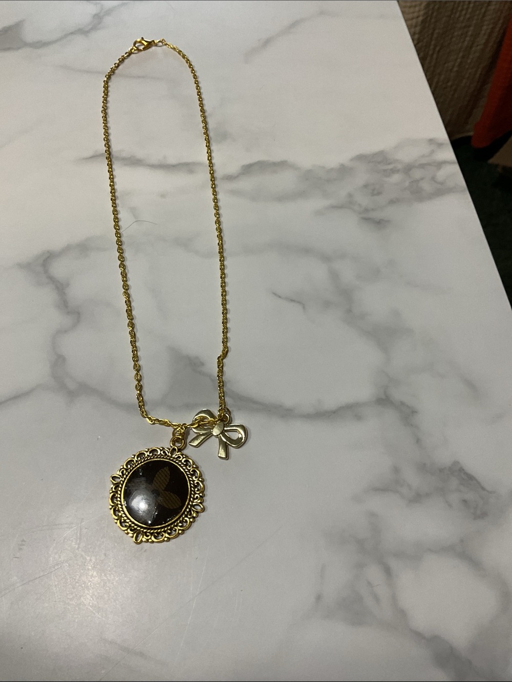 Upcycled Louis Vuitton Necklace In The Color Gold With Bow Charm